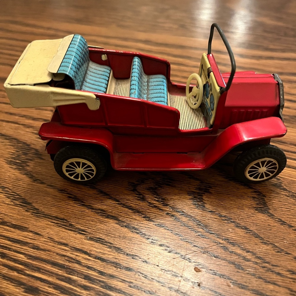 Collectible. Source Unknown Vintage Red Toy Car with friction movement.